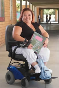 Student sitting in a power chair